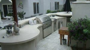 patio kitchen with concrete countertops, grill, and warming drawers near San Jose