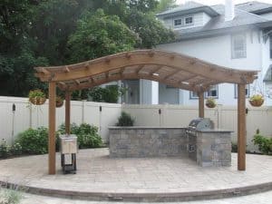 spacious patio with an outdoor kitchen and pergola near San Jose