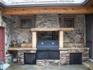 Rustic San Jose outdoor kitchen with a smoker and sink