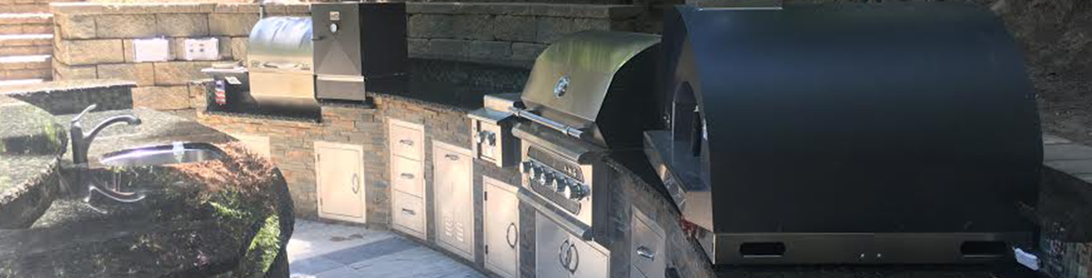 Outdoor kitchen in the San Jose area with grill, smoker, side burner and pizza oven